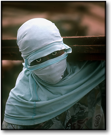 Color photograph of a dockworker, Sunda Kelapa Harbor, Jakarta Indonesia.