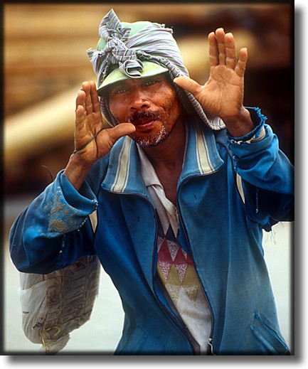 Color photograph of a dockworker, Sunda Kelapa Harbor, Jakarta Indonesia.