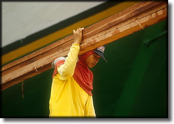Color photograph of a dockworker, Sunda Kelapa Harbor, Jakarta Indonesia.