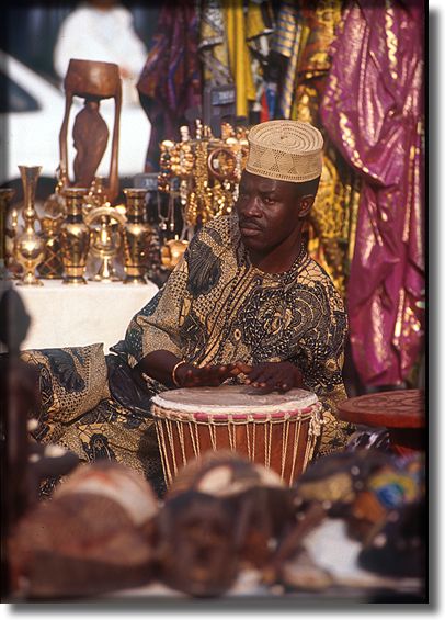 Picture of man playing bongo