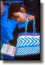 Photograph of child selling chicklets